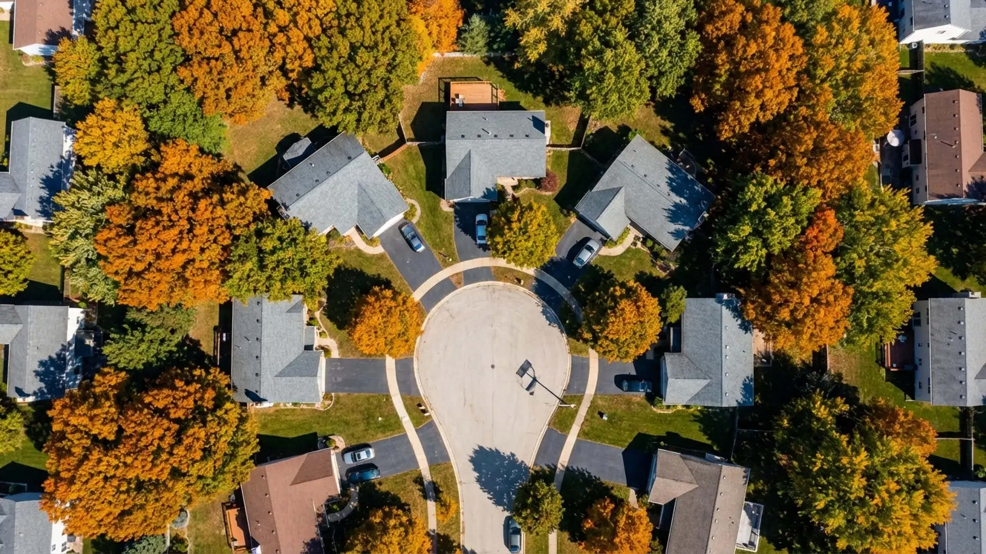 Aerial view of a residential cul-de-sac at peak fall color