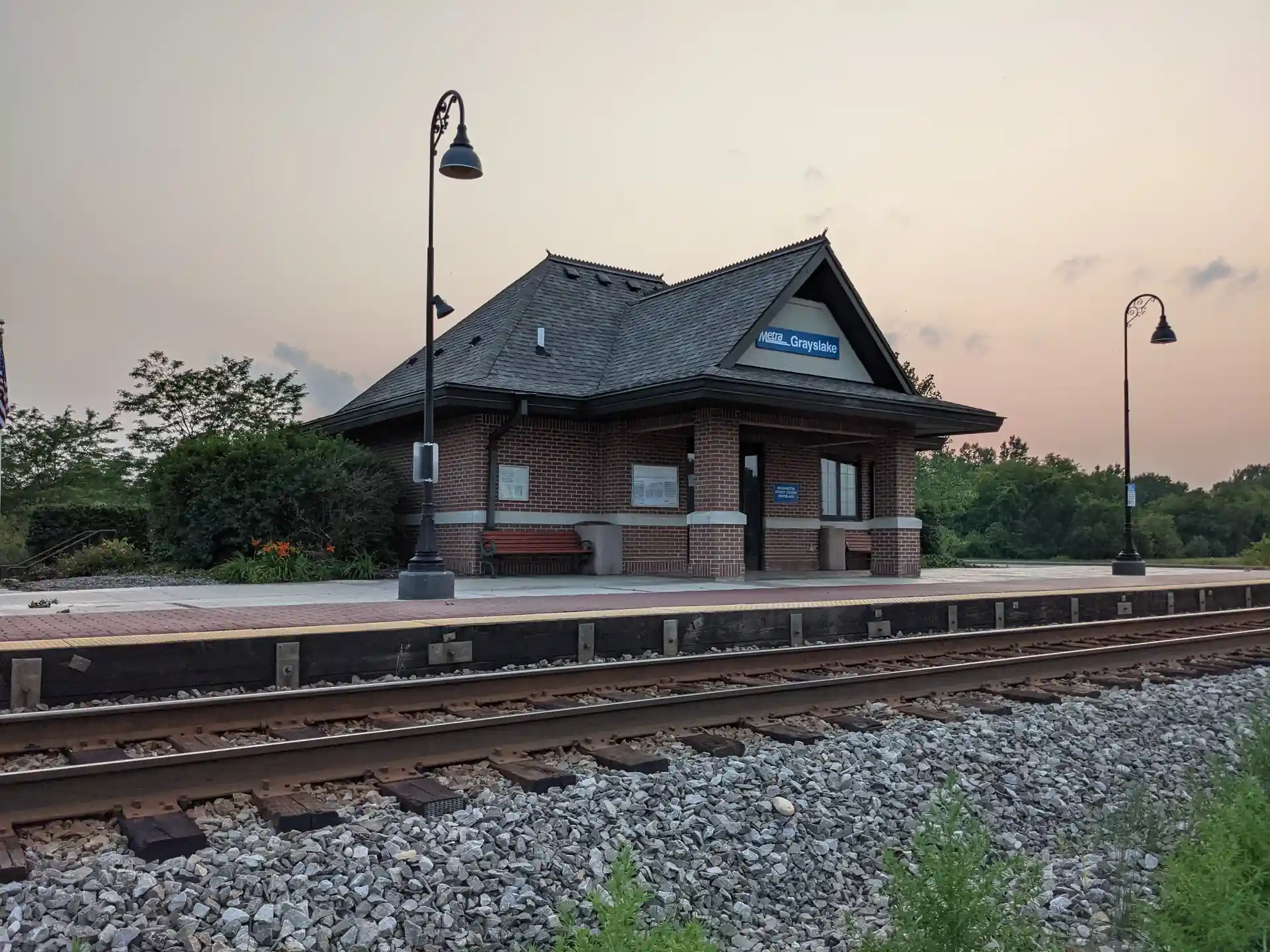 Washington Street Metra station on North Central Service line in Grayslake, Illinois, daytime track view