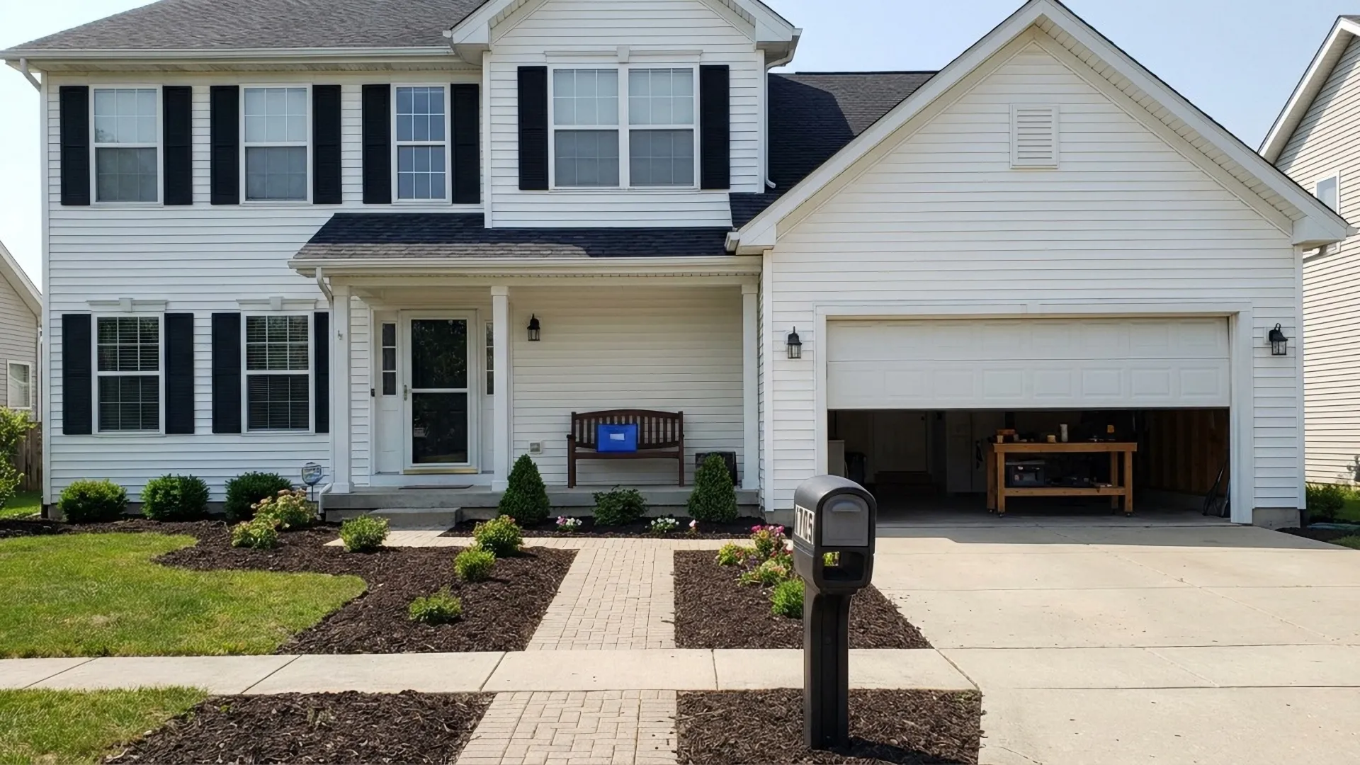 White colonial home with black shutters and landscaped walkway ready for appraisal